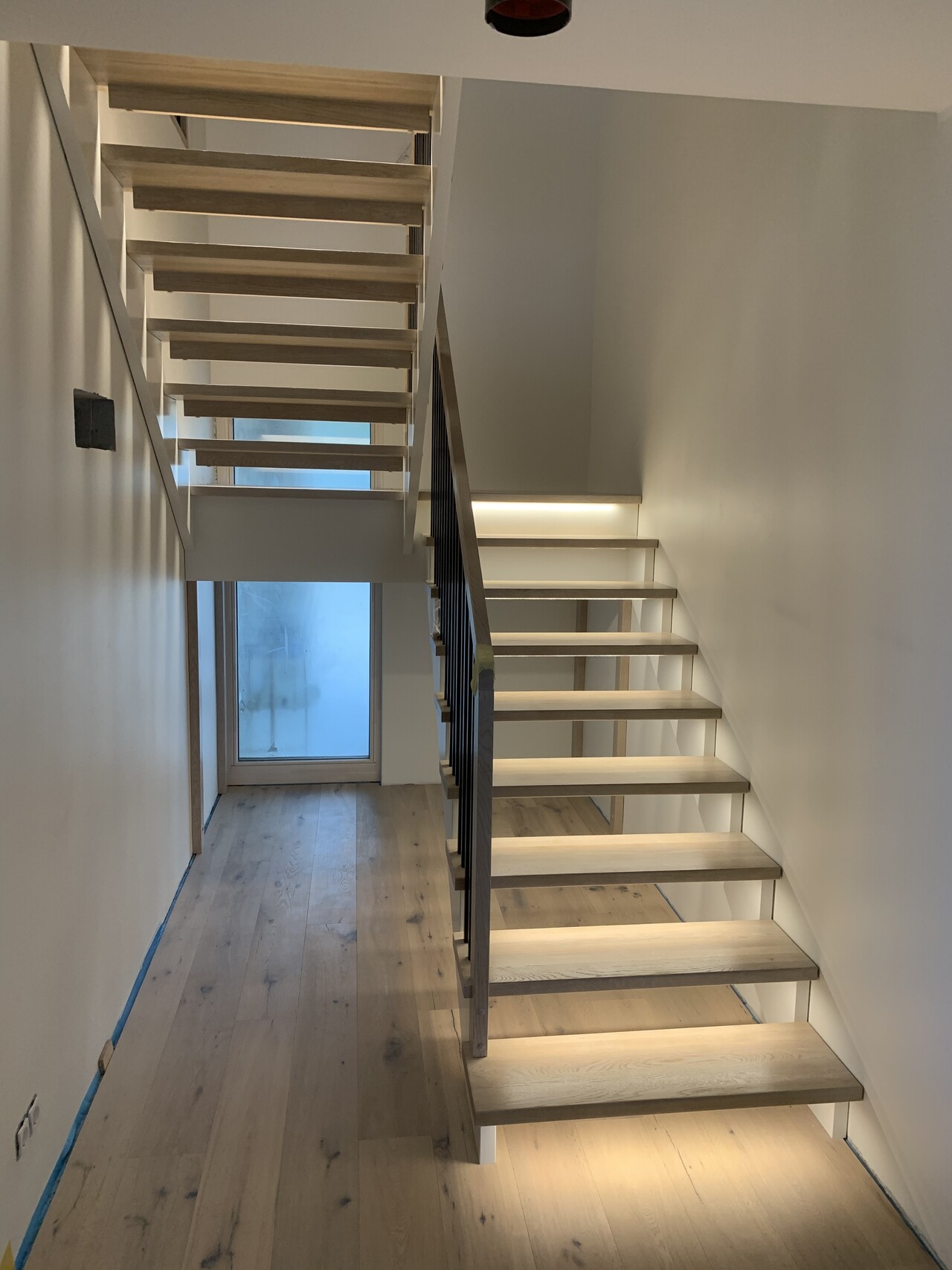 20. U-shaped staircase with a landing, LED lighting