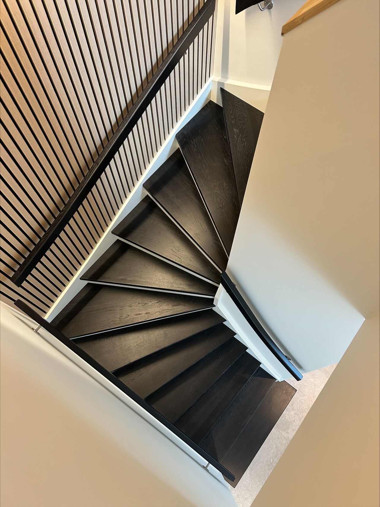 21. U-shaped staircase made of oak stained black