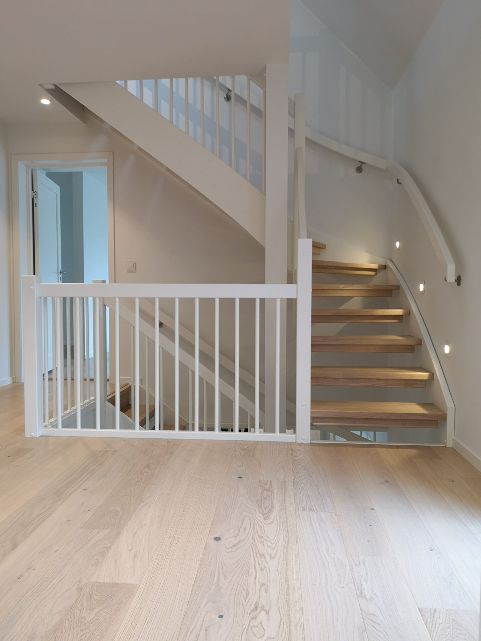 02. White, light wood and oak staircase with handrail through two floors