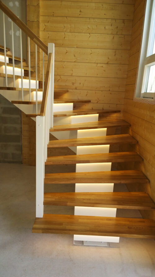 Center-beam L-shaped staircase with oak steps.